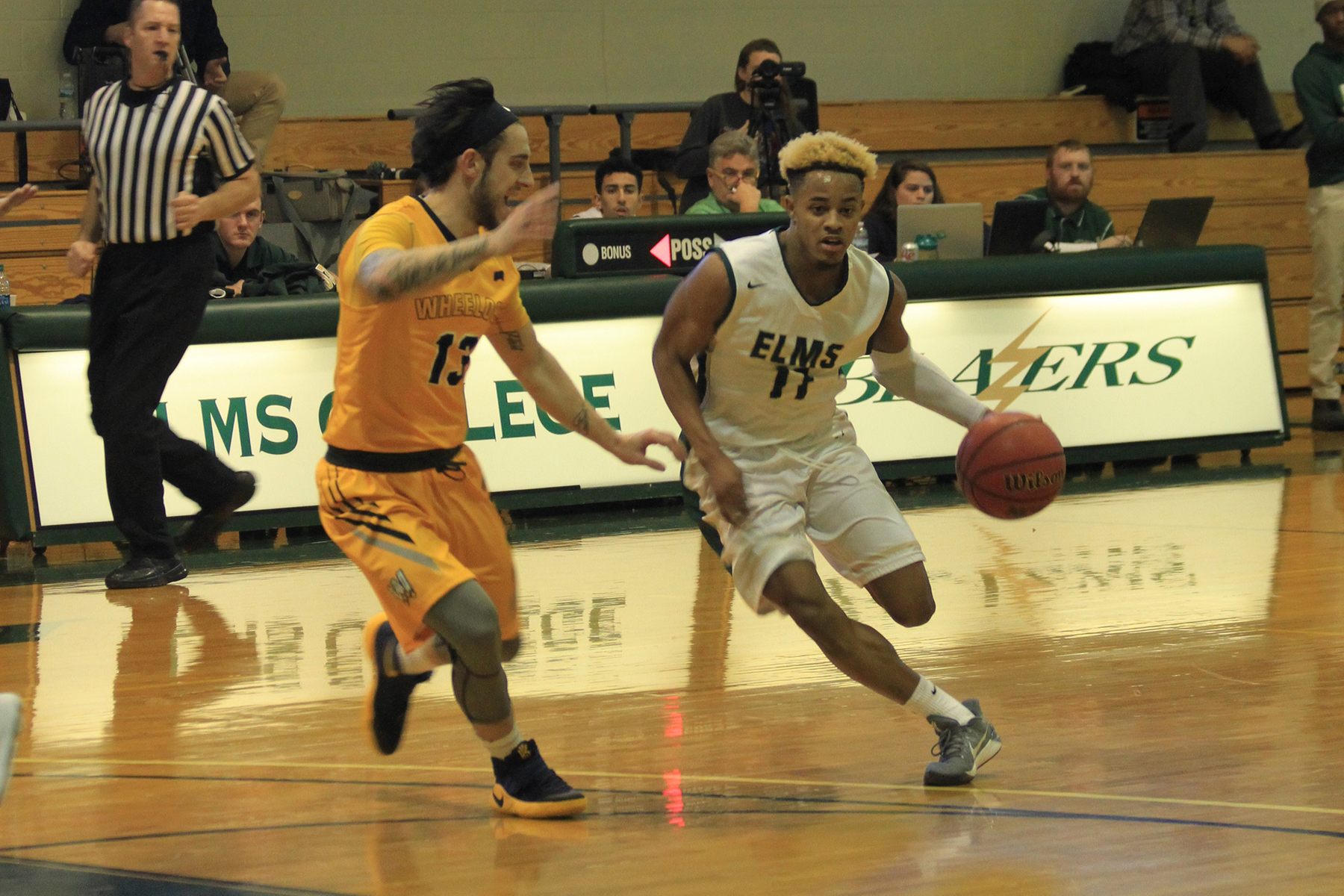 Wheelock Outlasts Men's Basketball